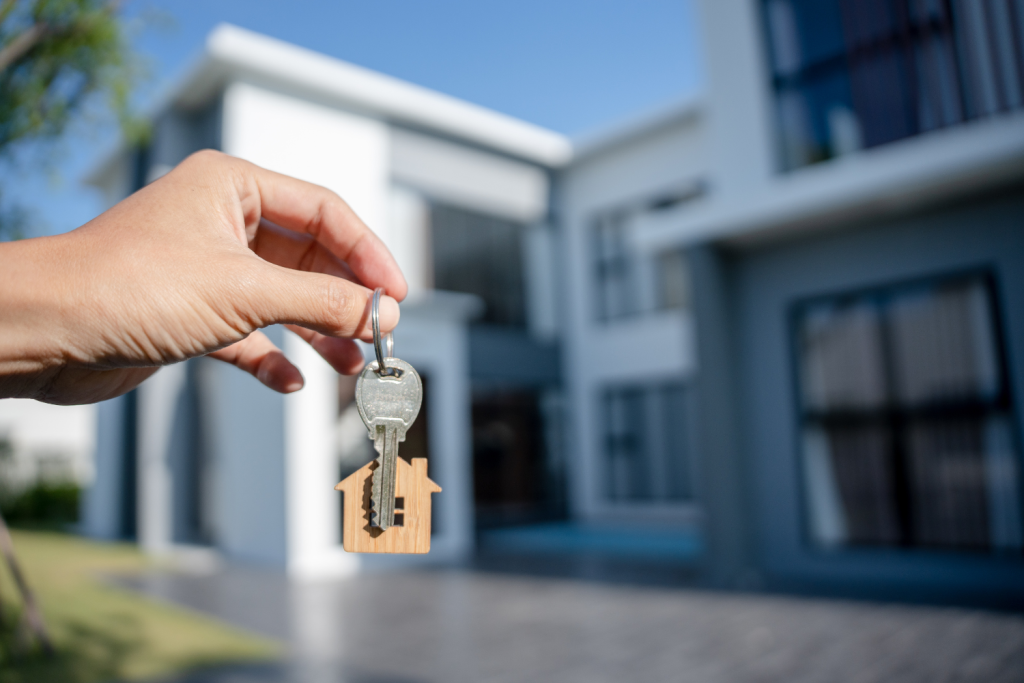 Self-employed couple receiving house keys after home loan approval